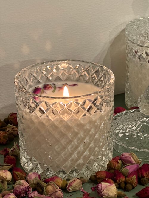 Free Elegant crystal candle surrounded by dried flowers and a glass lid, perfect for interior decor inspiration. Stock Photo