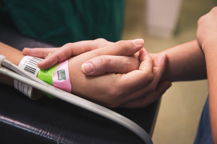 Holding Hands With Patient