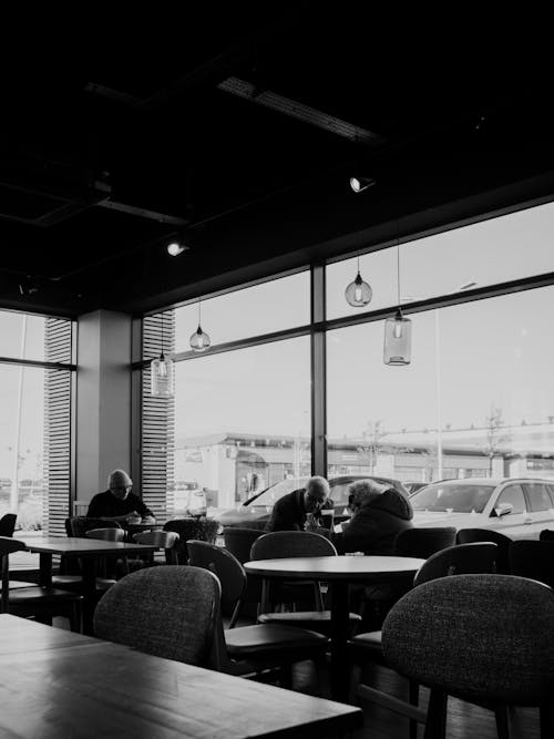 Cafe Customers Sitting at Tables