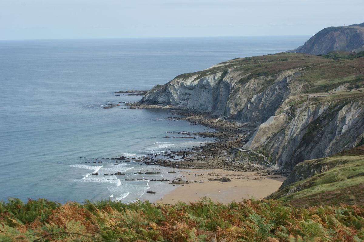 Green headlands and layered cliffs plunging into the Atlantic