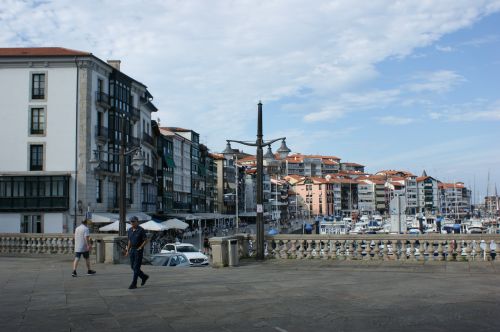 Free Vibrant promenade in Kemer, Turkey featuring yachts and local architecture against a bright summer sky. Stock Photo