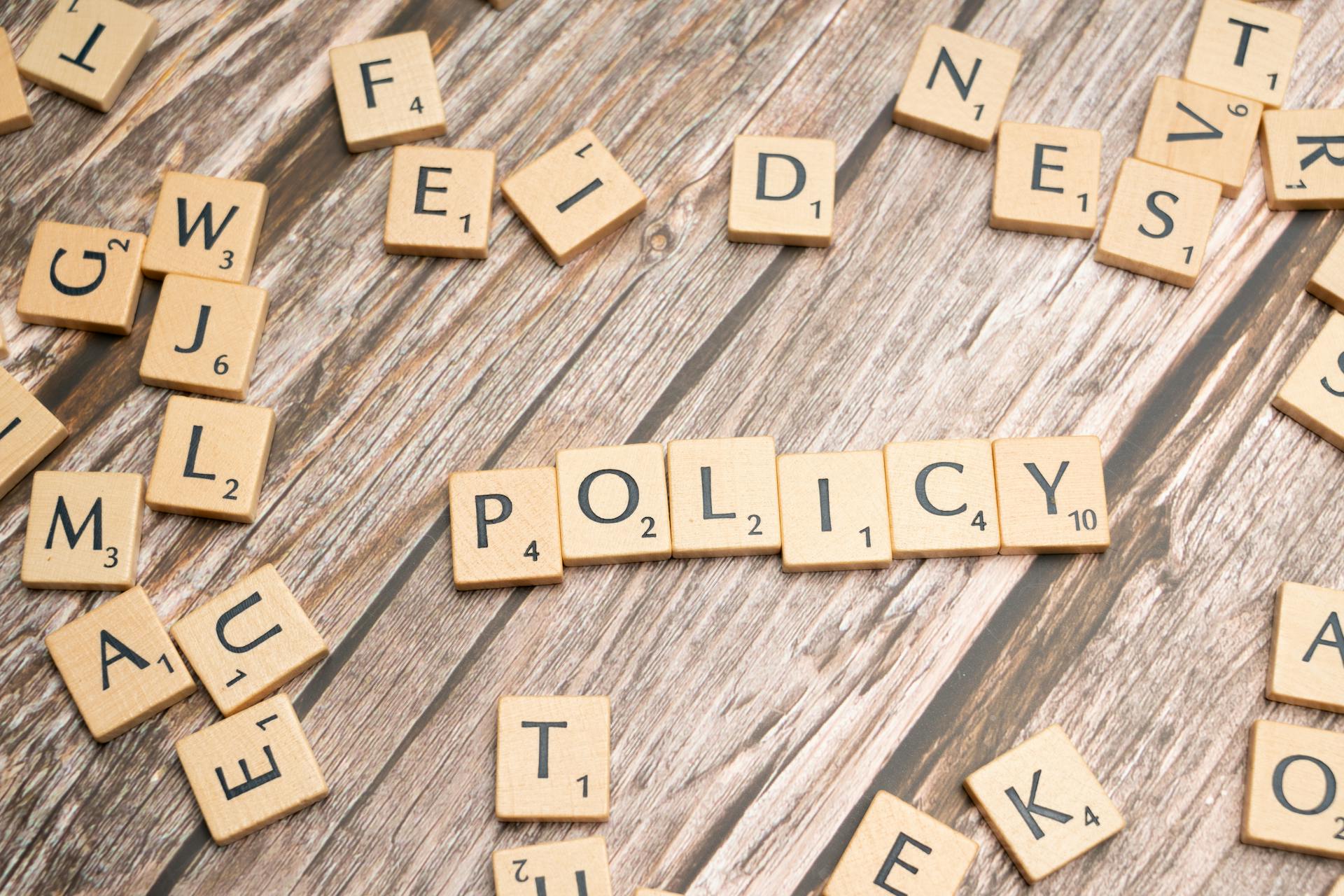 The word policy spelled out in scrabble letters