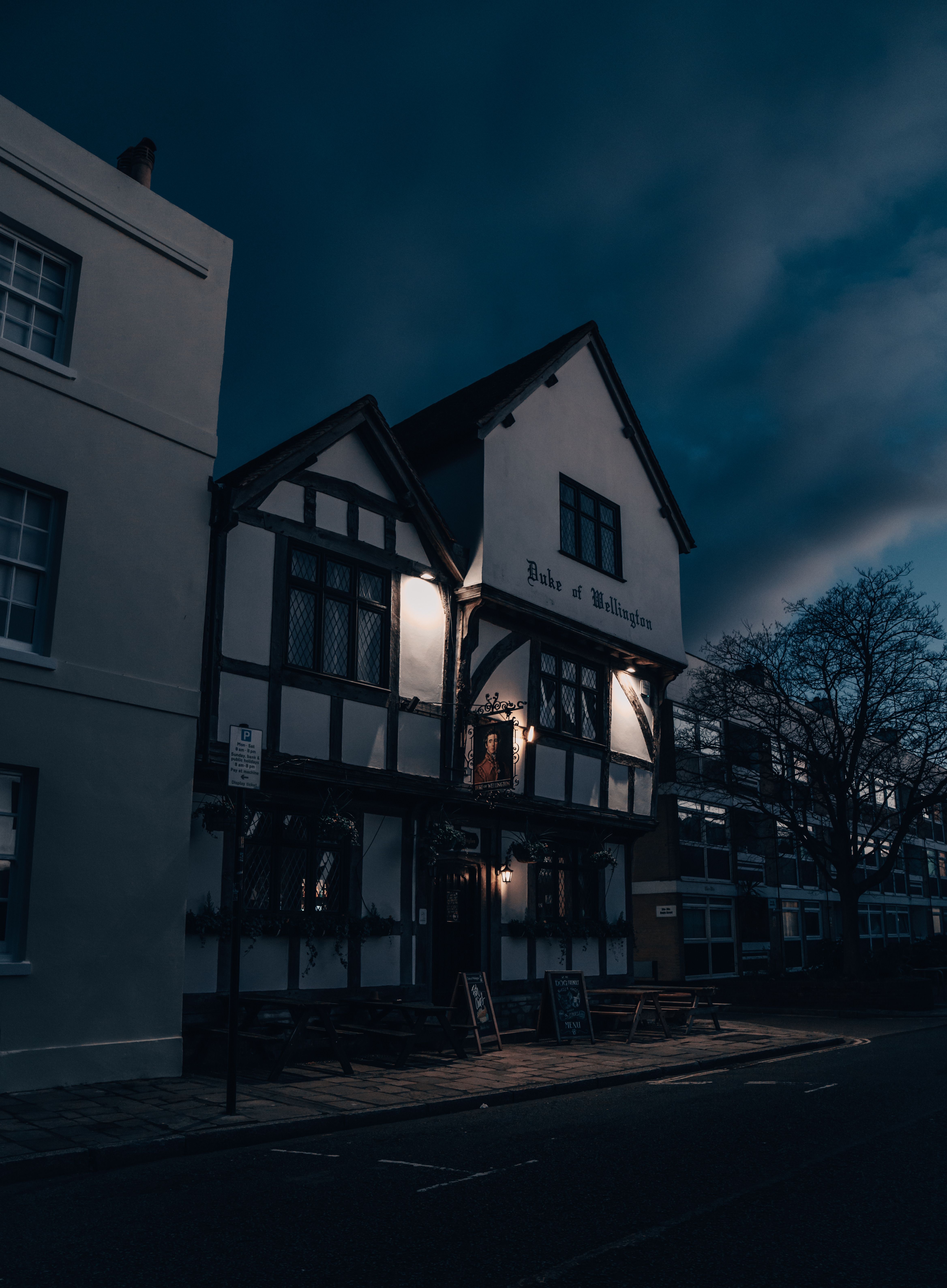 Historic Duke of Wellington pub showcasing Gothic architecture in Southampton, UK, illuminated at night.