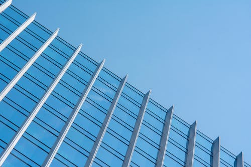 Low Angle Shot of a Modern Building with Glass Facade 