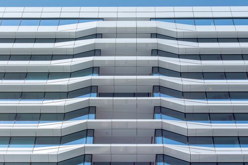 Free Clean lines and geometry of a contemporary multi-story building facade. Stock Photo