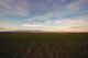 A wide green field under an open sky — photo by Orhan Pergel on Pexels