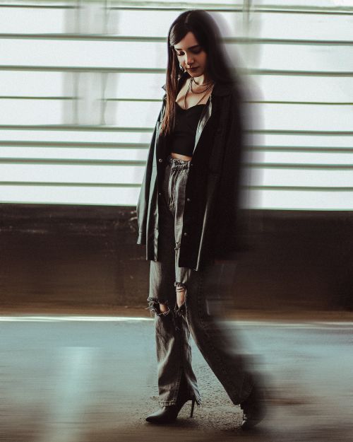 Free Stylish woman posing with blurred motion in urban environment. Stock Photo
