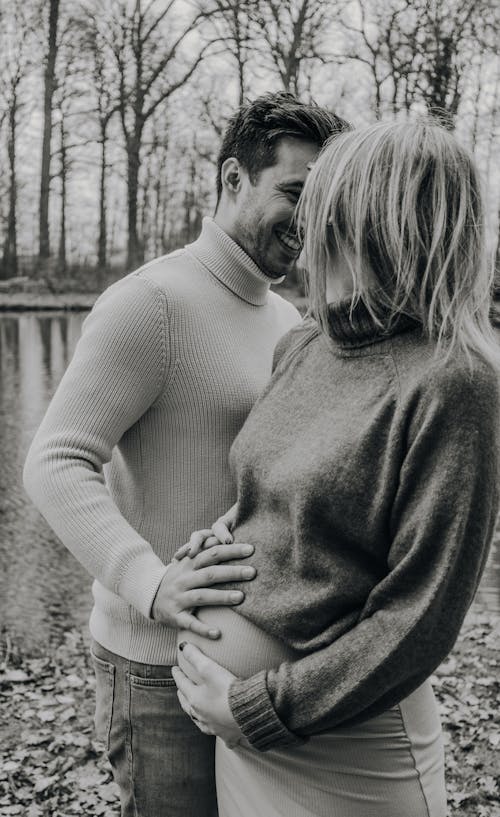 Happy Couple Touching Her Pregnant Belly