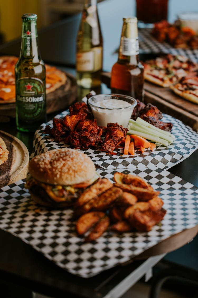 Roasted Boneless Chicken Wings With Cream Sauce And A Burger With Fries