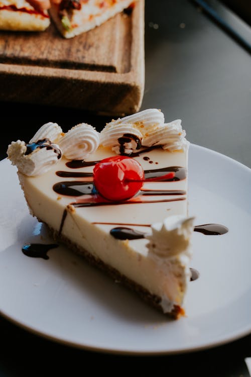 Slice of Cheesecake with a Candied Cherry