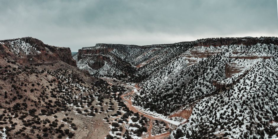 A breathtaking view of a snowy canyon in White Rock, NM, capturing the winter landscape.