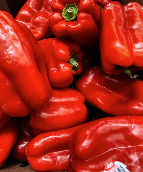 Free A vibrant collection of fresh red bell peppers showcasing textures and colors. Stock Photo