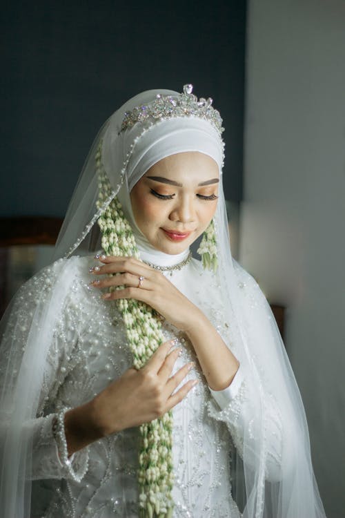 Bride in Beautiful Wedding Dress with Veil