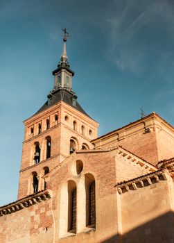 The historic Church of St. Martin in Segovia, Spain, under a clear daytime sky.