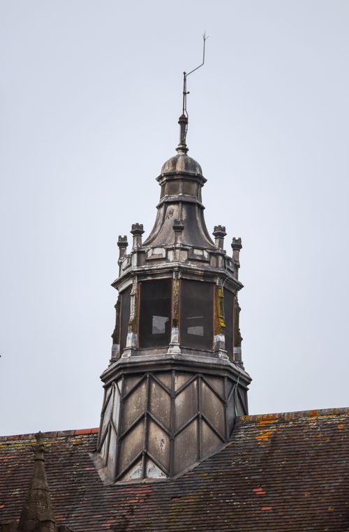 Free Close-up of an old architectural tower featuring vintage design and weathered rooftop. Stock Photo
