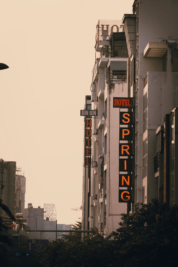 Neon Hotel Signs On Buildings