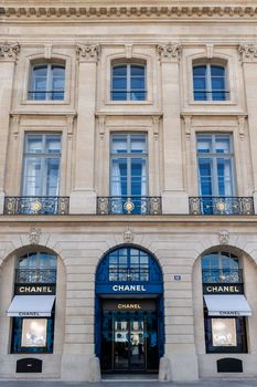 Elegant facade of a luxury Chanel store in Paris captured in daylight.