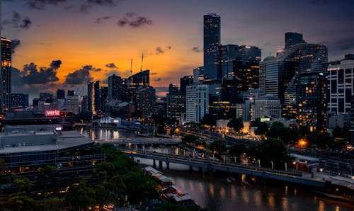 View of a Modern Illuminated Skyscrapers in City at Sunset