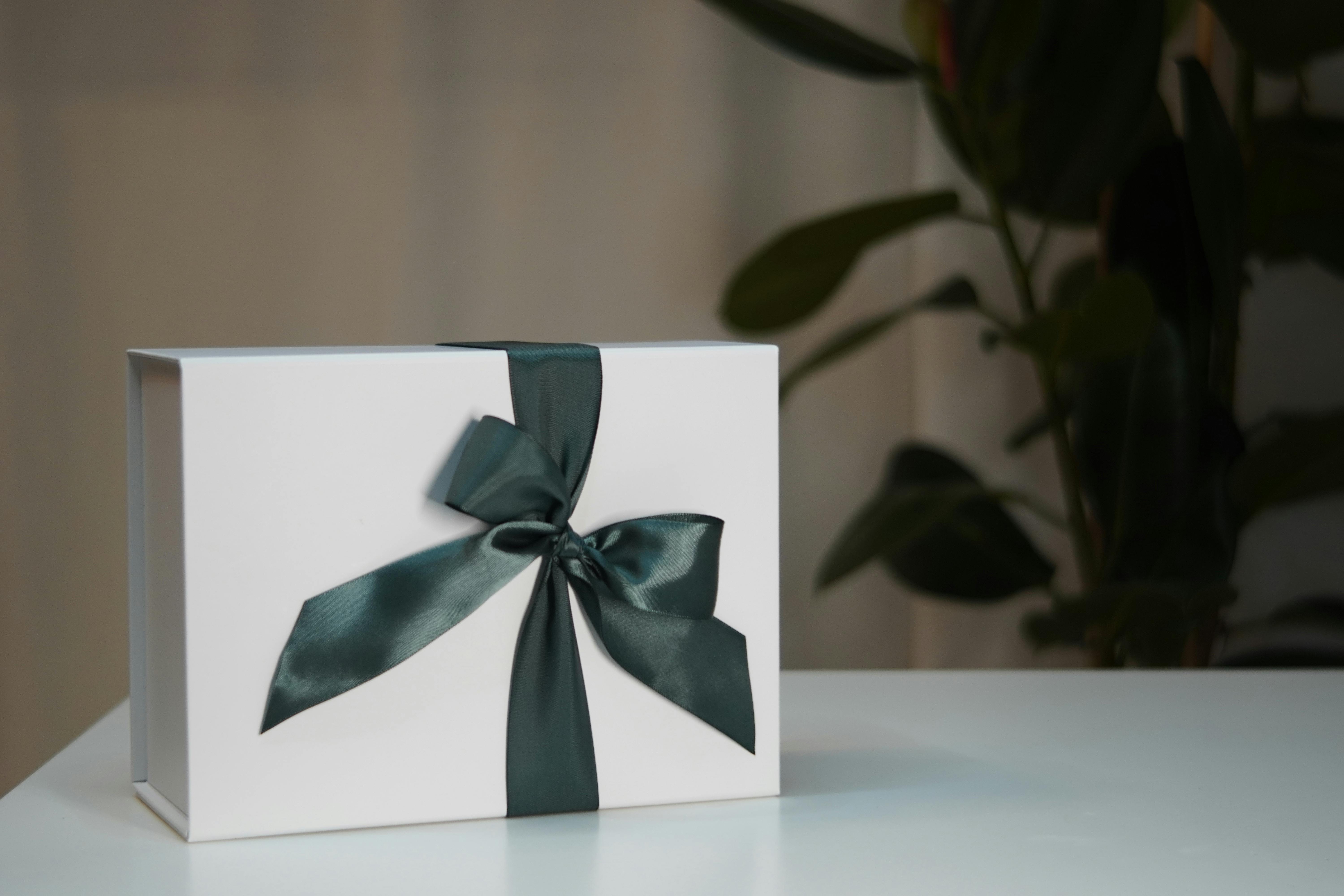 Gift box with a green bow. by Johny VDR