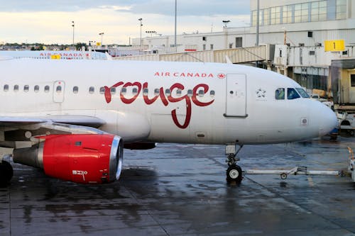 A Canada Rouge Airliner Parked at an Airport