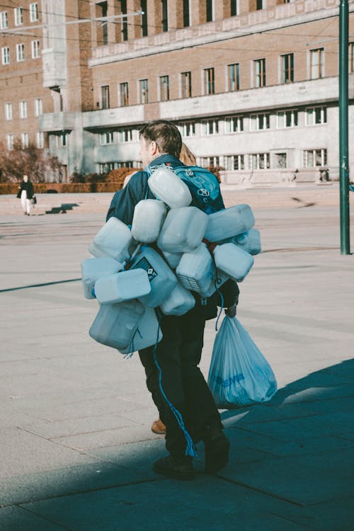 A man carrying a bag of marshmallows