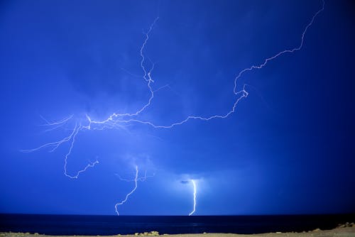 View of Lightning Strikes over a Sea 