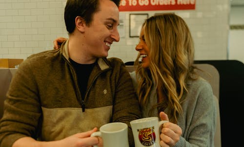 Smiling Couple Sitting Together