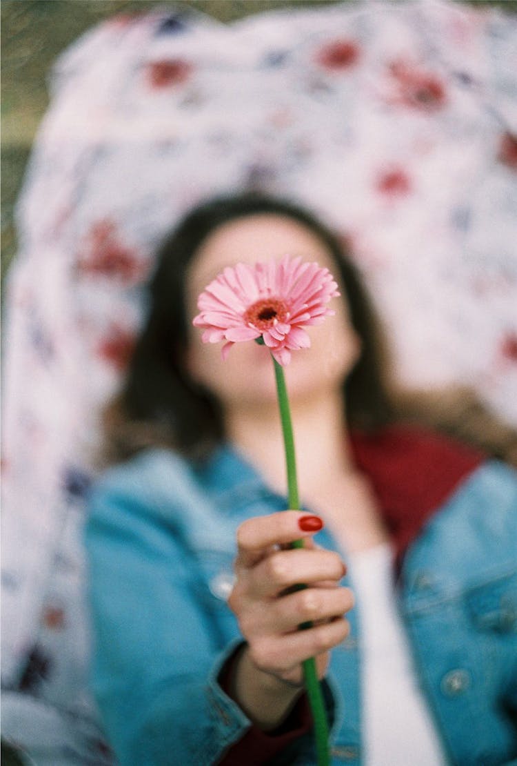 Woman Holding A Flower