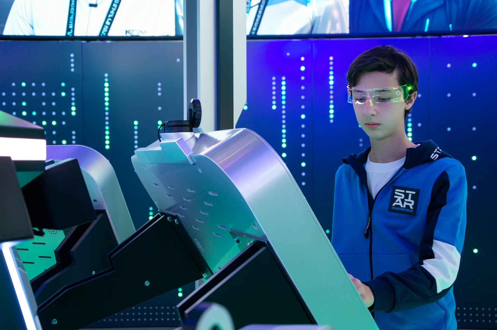 Teen engaging with modern interactive technology setup wearing smart glasses.