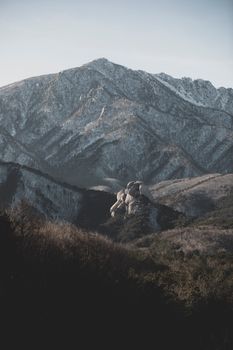 Breathtaking view of snow-covered mountain range with a dramatic landscape. Perfect for nature and winter themes.