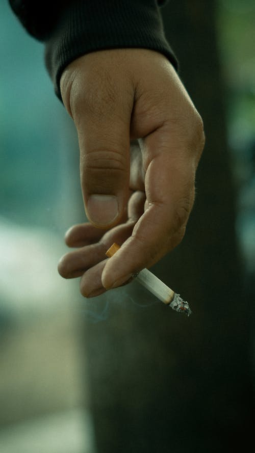 Man Hand Holding Cigarette