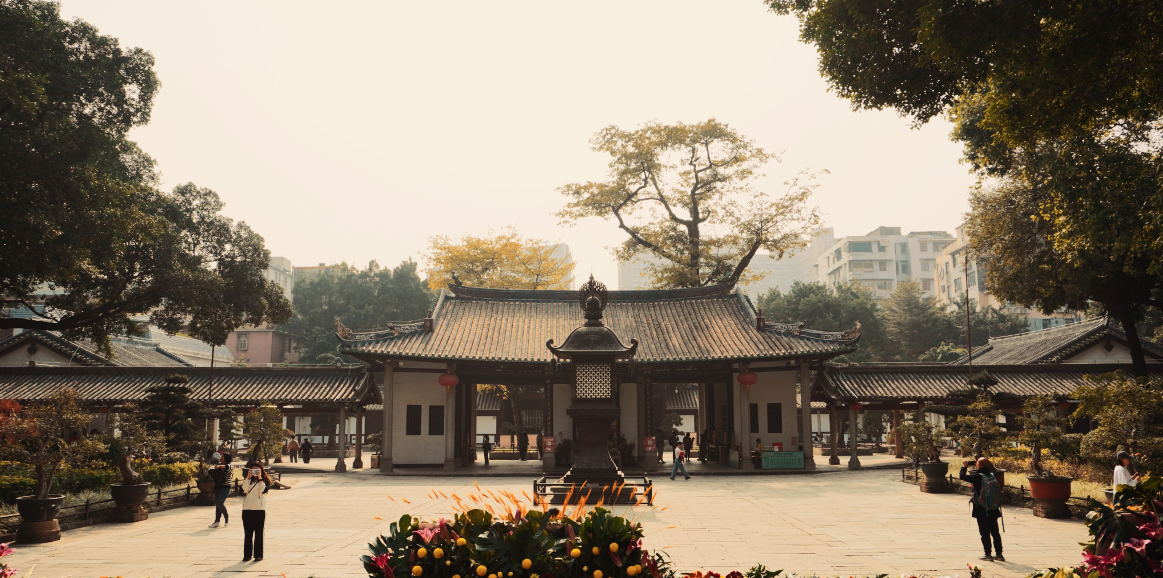 The main hall of Guangxiao Temple with incense smoke rising