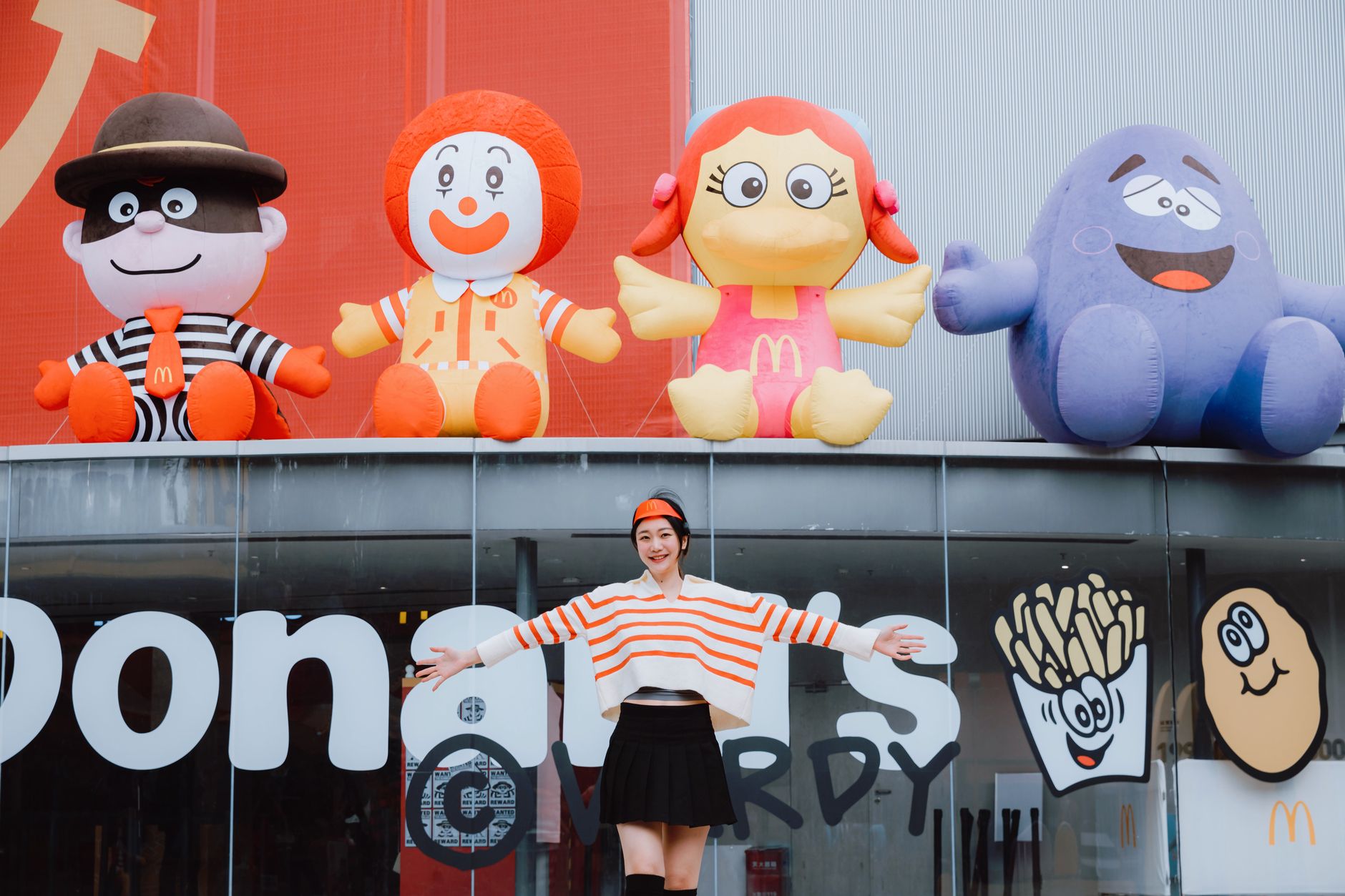 Ronald McDonald in costume, a cheerful clown mascot at McDonald's