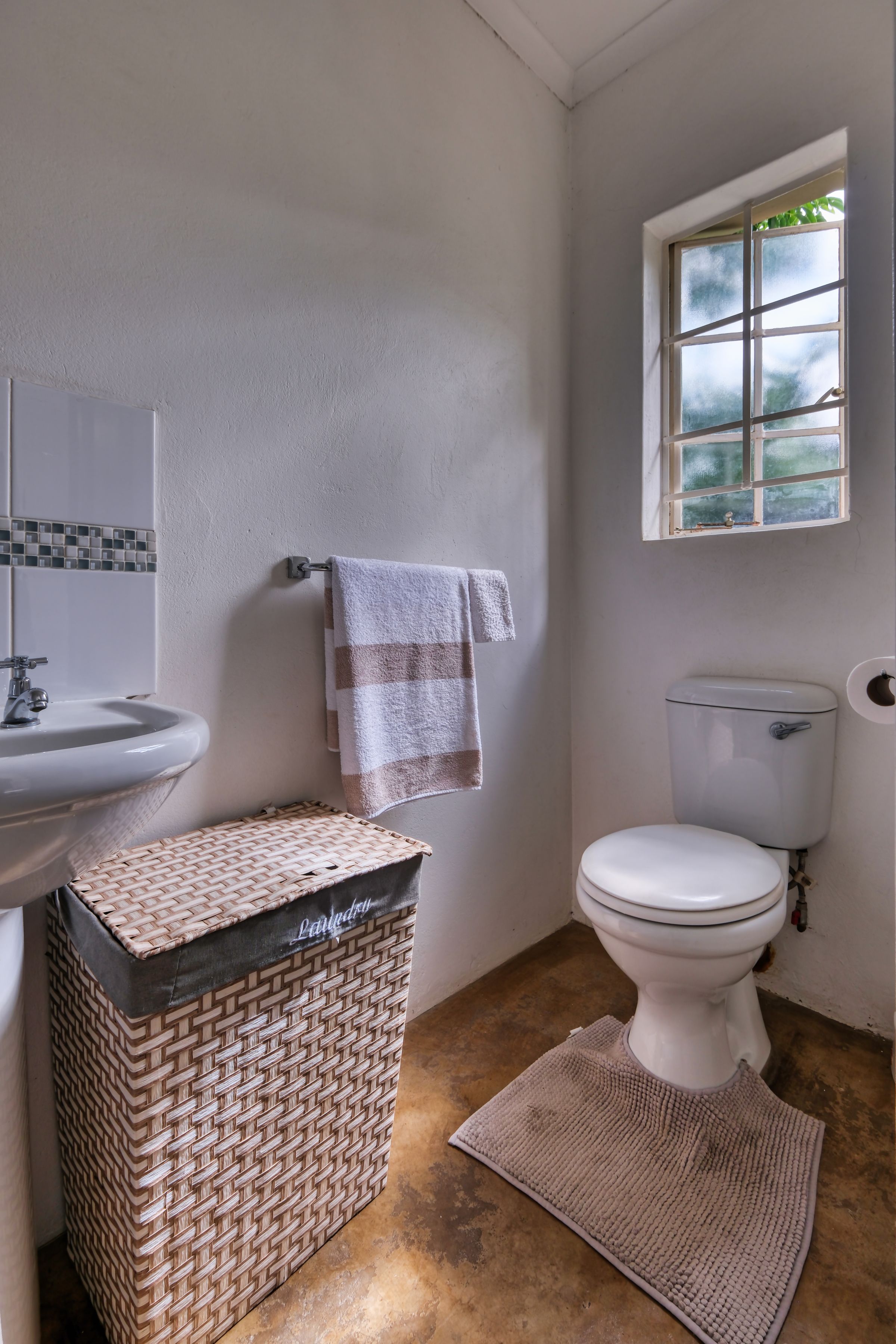 Wicker storage basket in a calm everyday bathroom