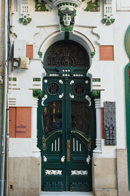 Ornamented Door on White Building Wall