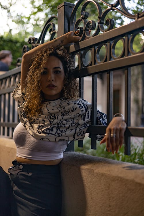 Woman Posing by Fence