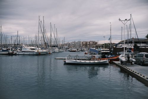 Free Explore the calm and picturesque marina in Torrevieja, Valencia, Spain, featuring moored sailing boats. Stock Photo