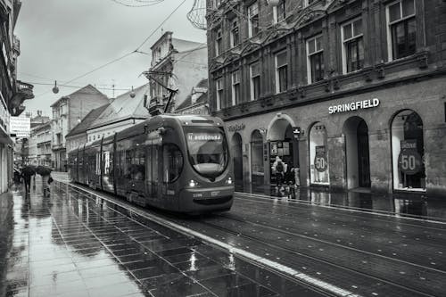 Tram Going Through a Street in a City