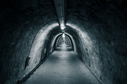 A dimly lit tunnel in Zagreb, capturing an urban underground scenery with a noir appeal.