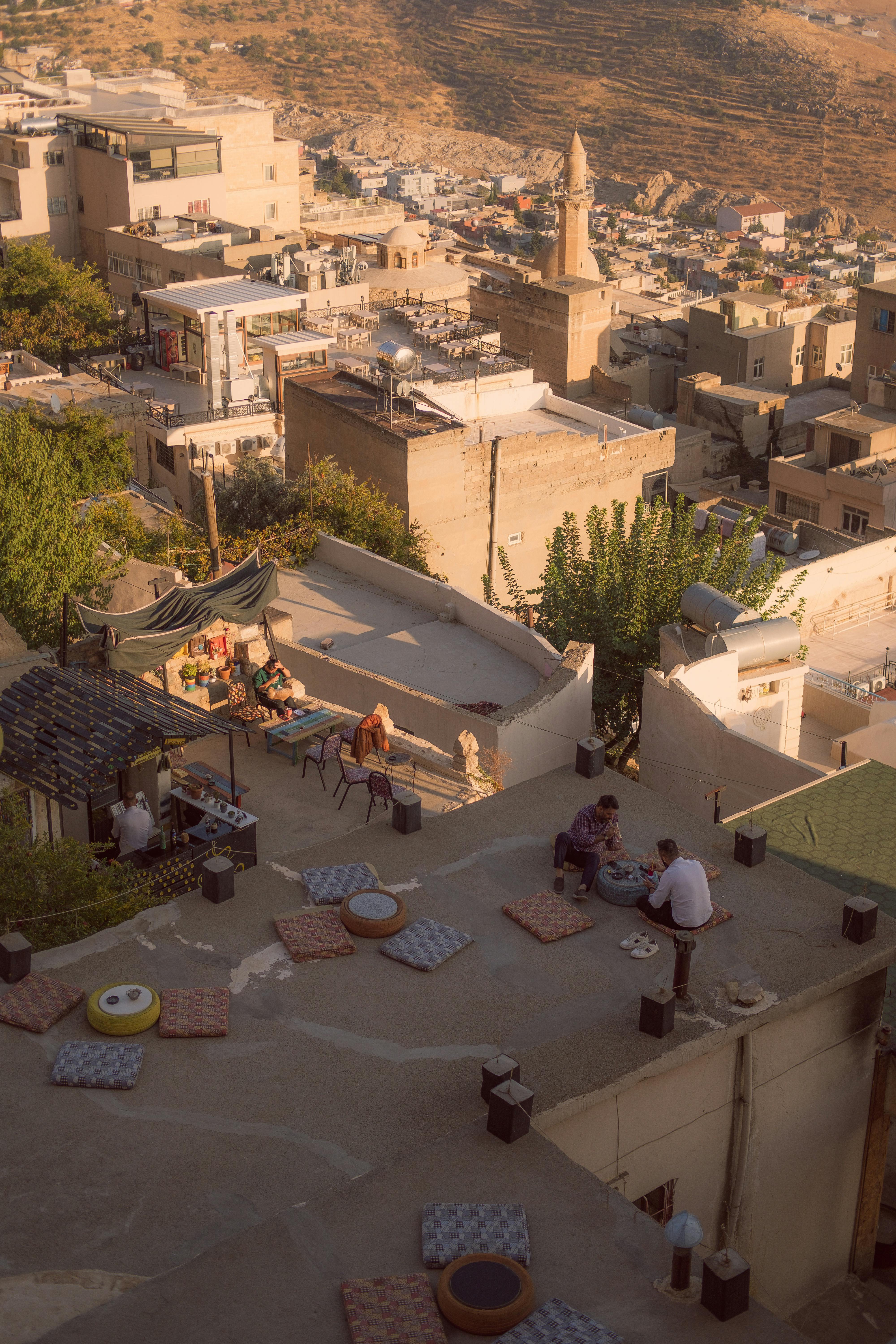 Captivating rooftop scene showcasing Mardin's unique architecture and vibrant community life.