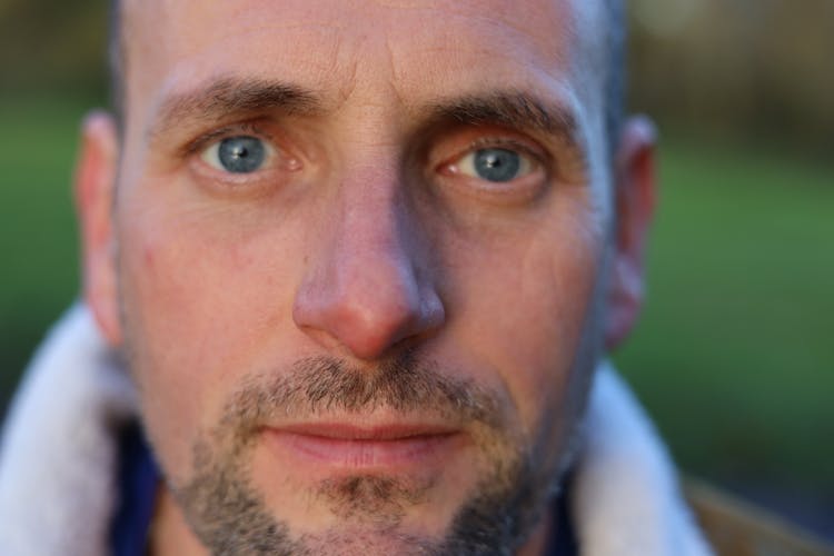 Close-up Portrait Of An Adult Man With A Stubble 