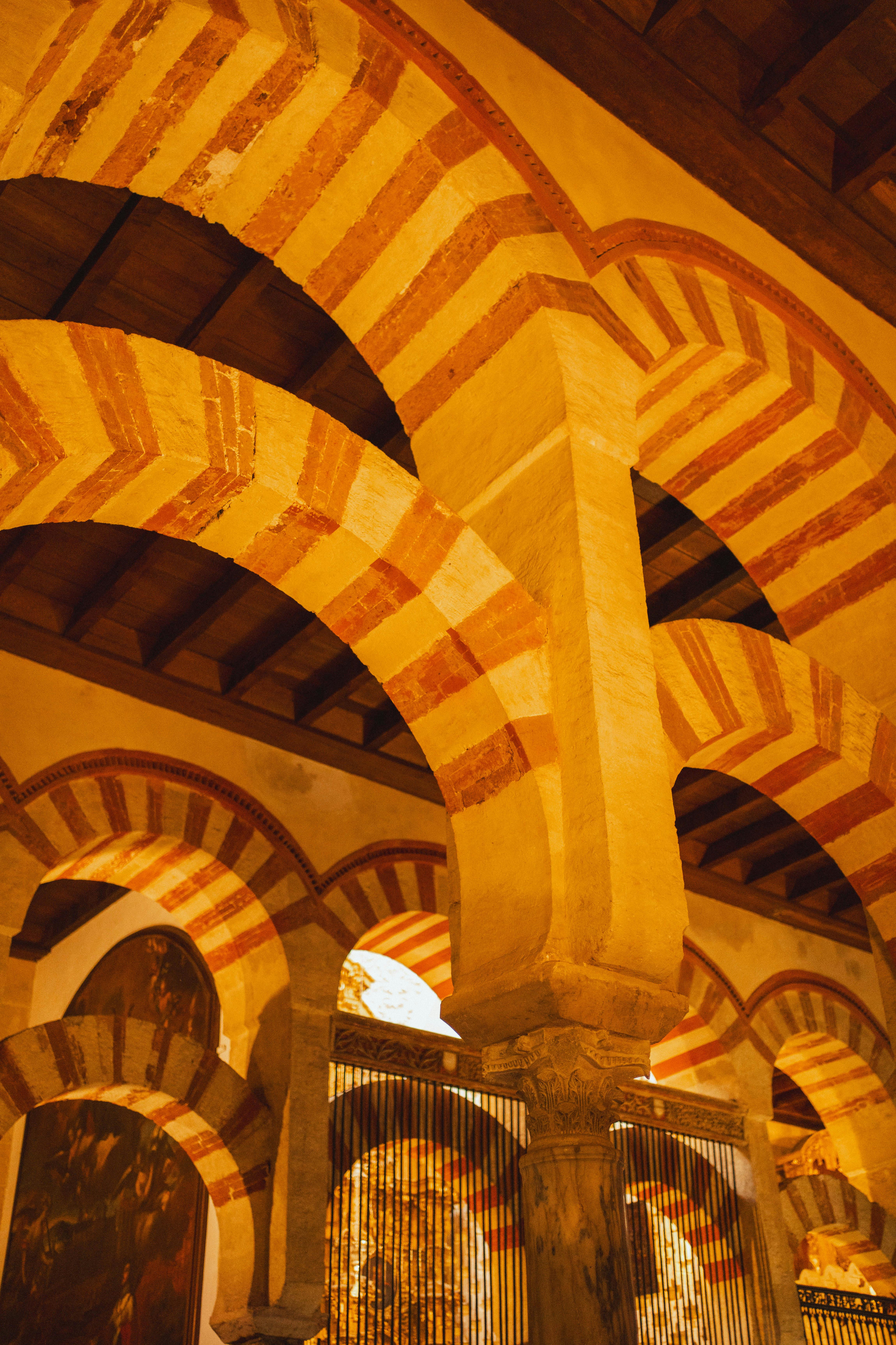 Captivating view of the Moorish arches inside the historic Mosque–Cathedral of Córdoba, Spain.