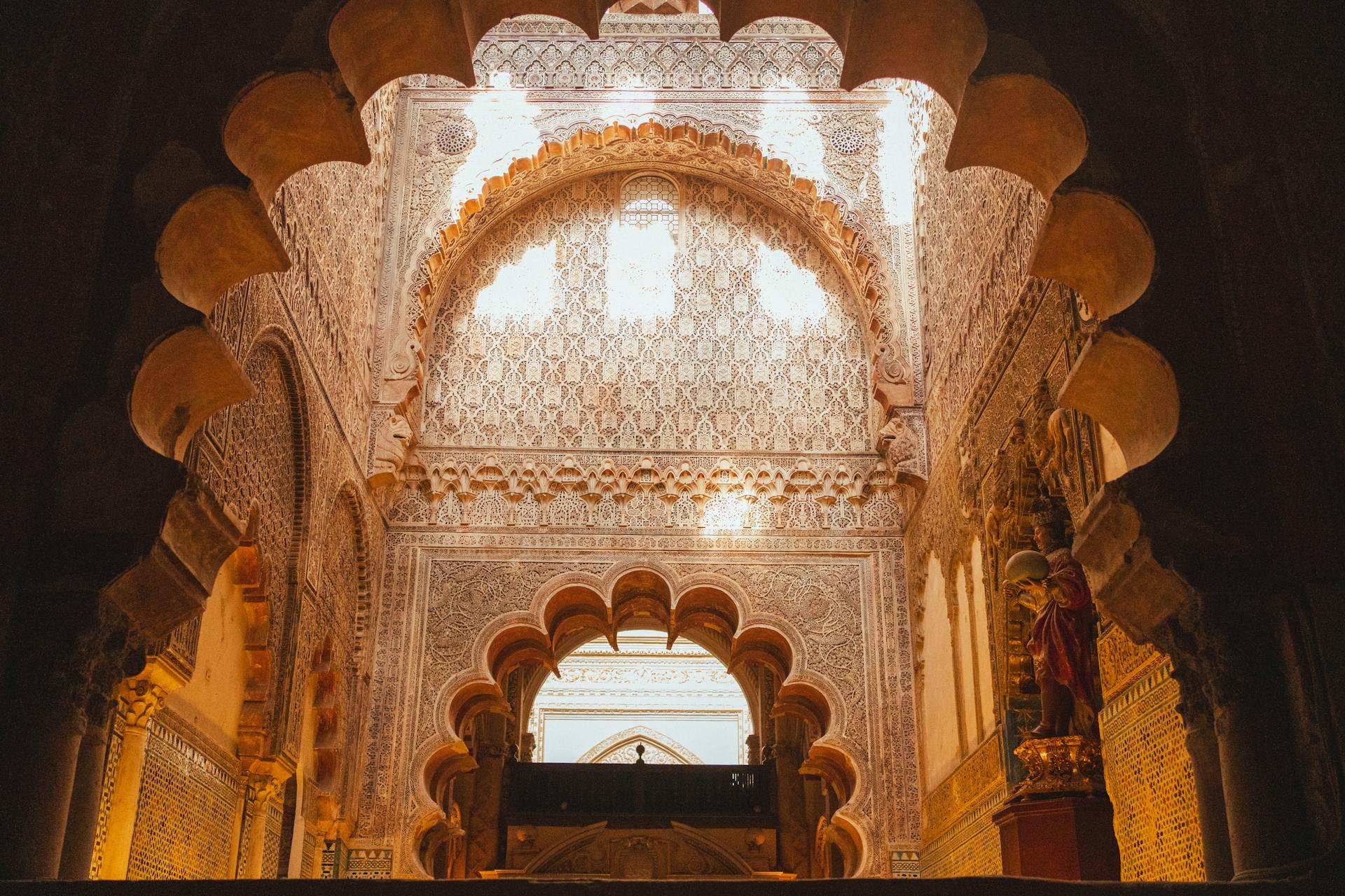 Stunning interior view of the Mosque-Cathedral of Córdoba featuring intricate arches and Moorish patterns.