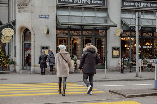 Woman and Man Crossing Street in Zurich, Switzerland