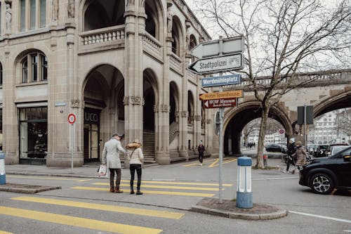Man and Woman Standing on Street in Zurich, Switzerland