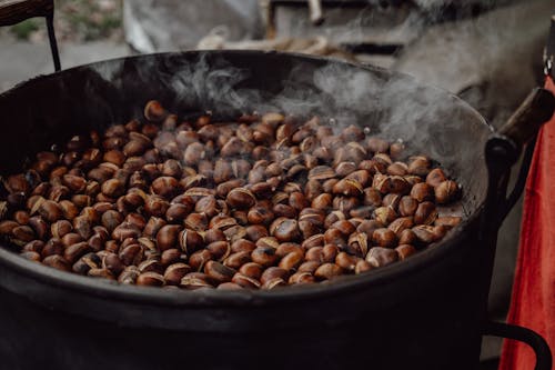 Free Coffee Beans Roasted in Black Pot Stock Photo