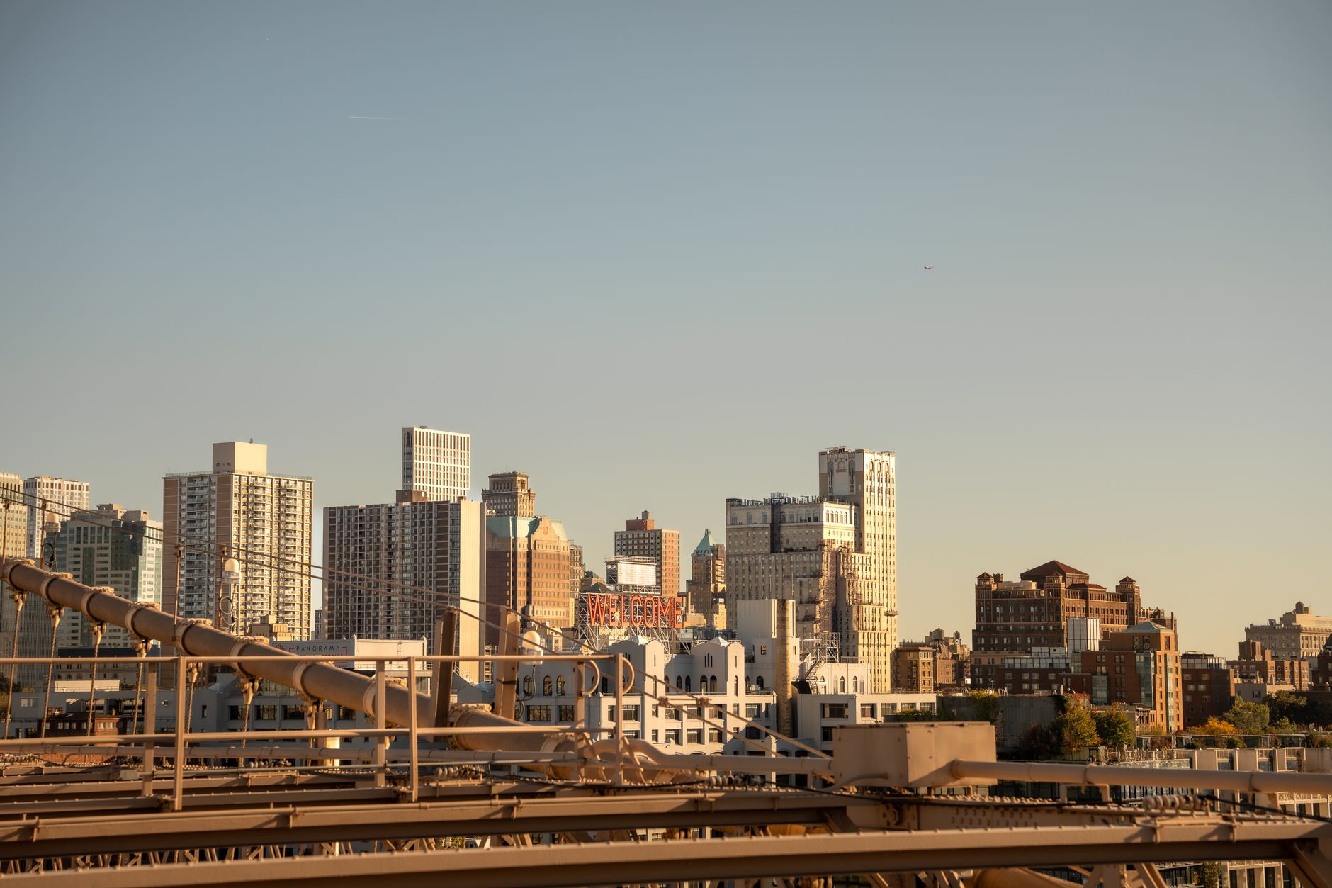 Explore the iconic skyline of New York City captured from Brooklyn Bridge, showcasing urban architecture and vibrant city life.