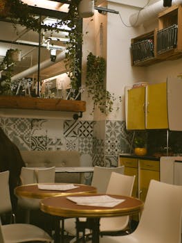 Warm restaurant interior featuring vintage decor and modern furniture, perfect blend of style.