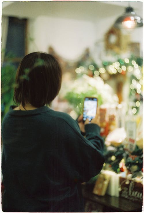 Back View of a Person Taking a Photo