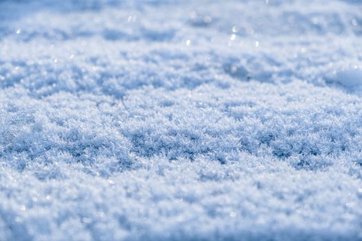 Detailed texture of frost-covered snow on a field, capturing the essence of winter in Germany.